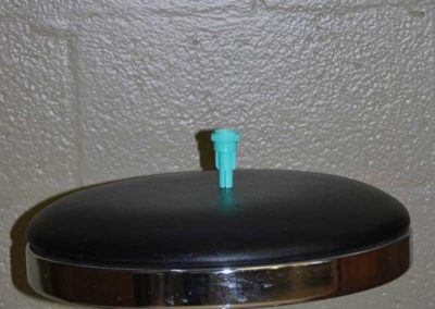 A piece of blue plastic sitting on a stool.